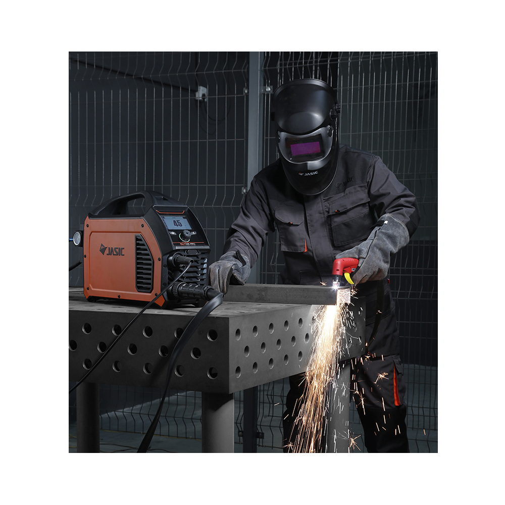 Man using plasma cutter to cut metal bar