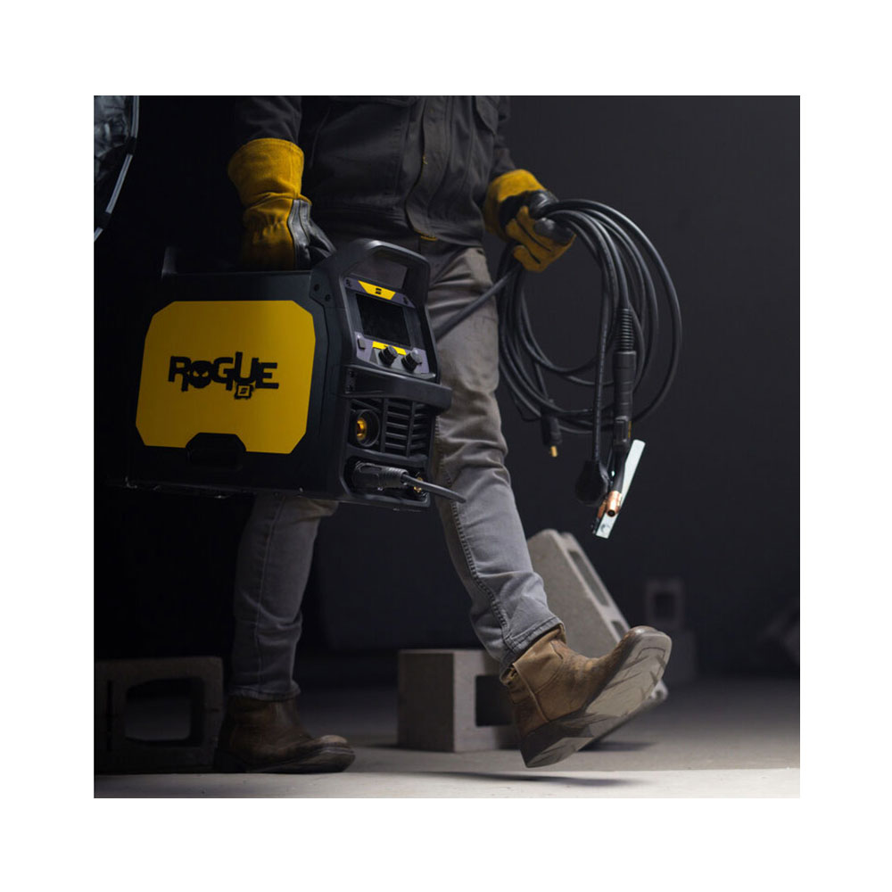 Man carrying the ESAB Rogue MIG Welder